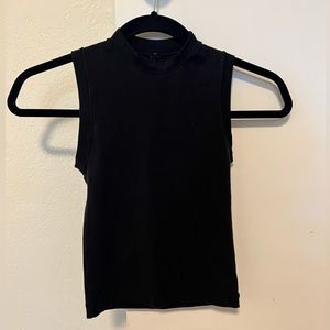 Skims high neck sleeveless top